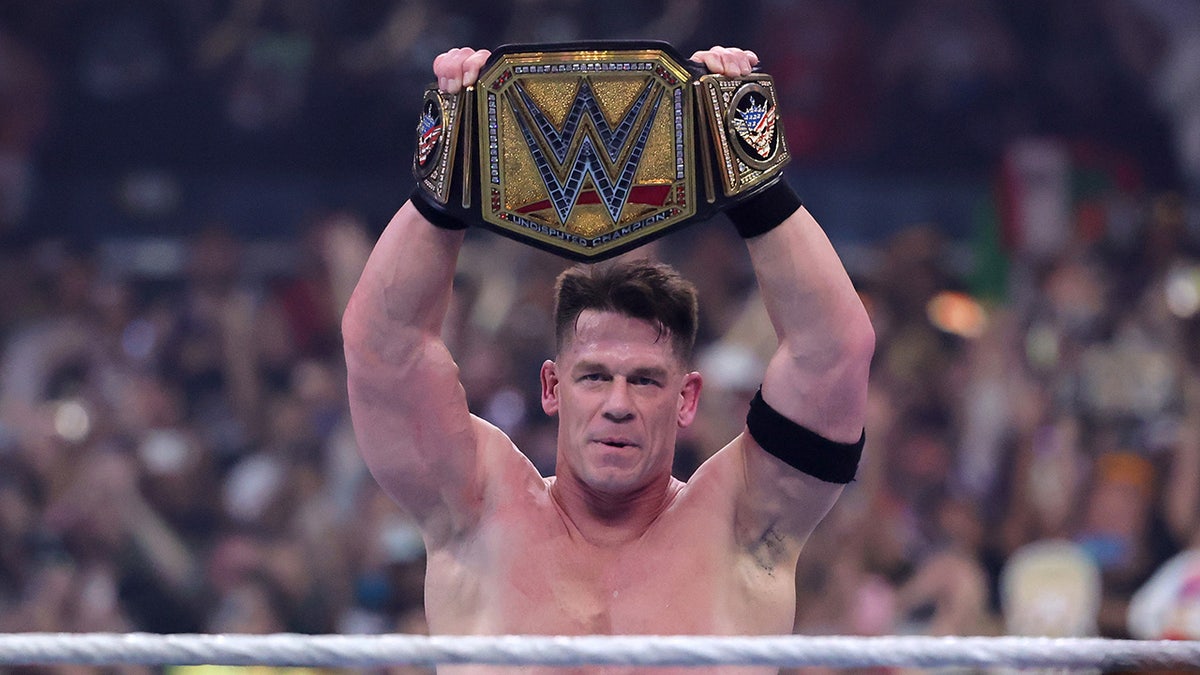 John Cena raises the title