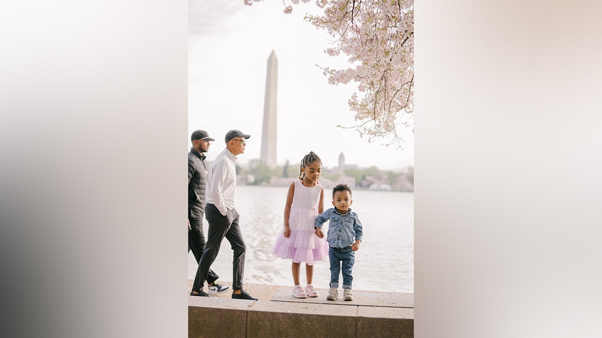 Former President Barack Obama walking through family's picture