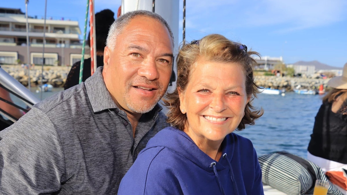 Paul and Christy Akeo on a boat
