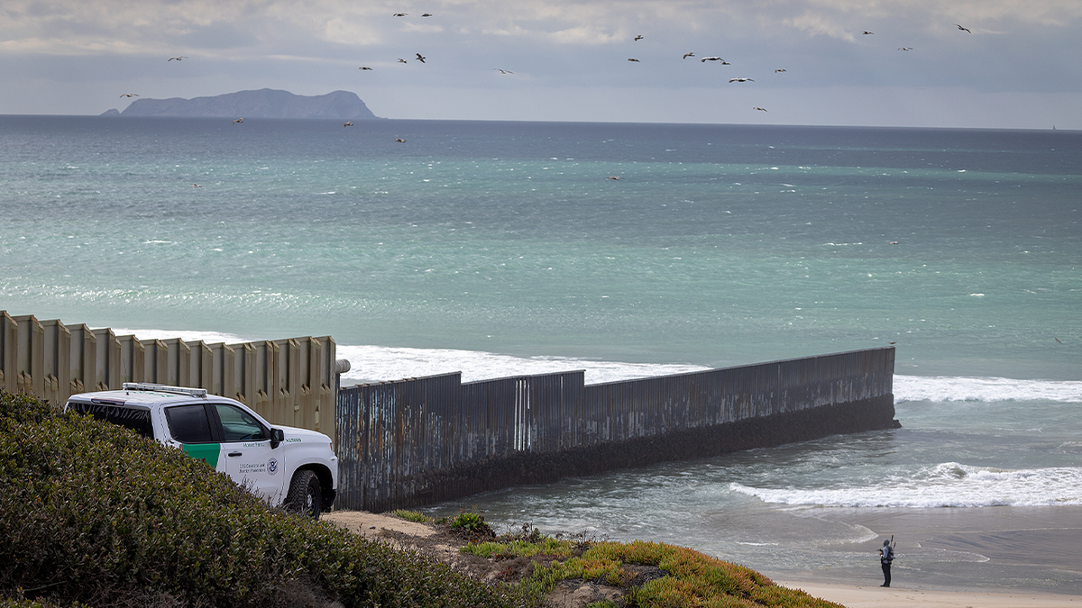 A U.S. Customs and Border Protection officer patrols in a truck along the U.S.-Mexico border wall in Imperial Beach, San Diego, on Jan. 25, 2025. 