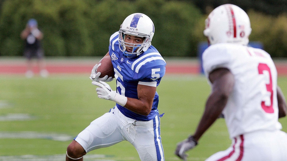 Duke Blue Devils wide receiver Brandon Braxton (5) looks for running room against Stanford Cardinal safety Michael Thomas (3) during the first half at Wallace Wade Stadium.