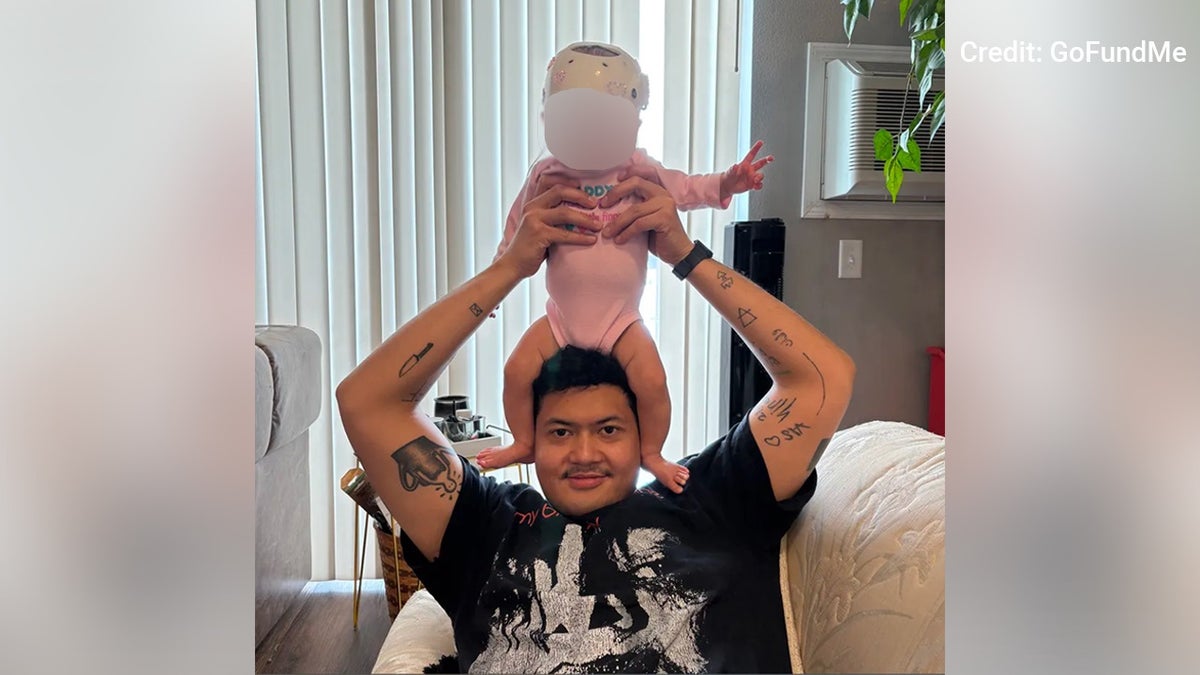 Aditya Harsono with infant