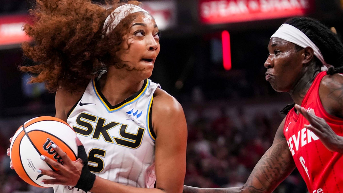 Angel Reese against Natasha Hoawrd