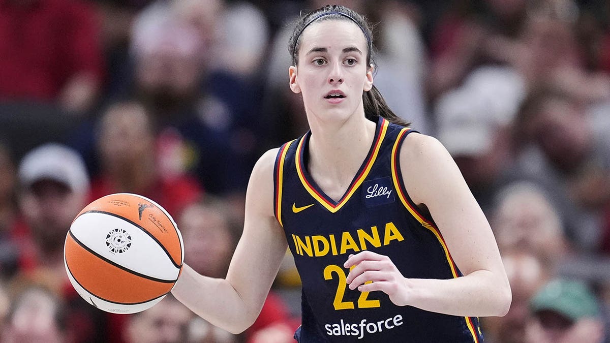 Caitlin Clark dribbles
