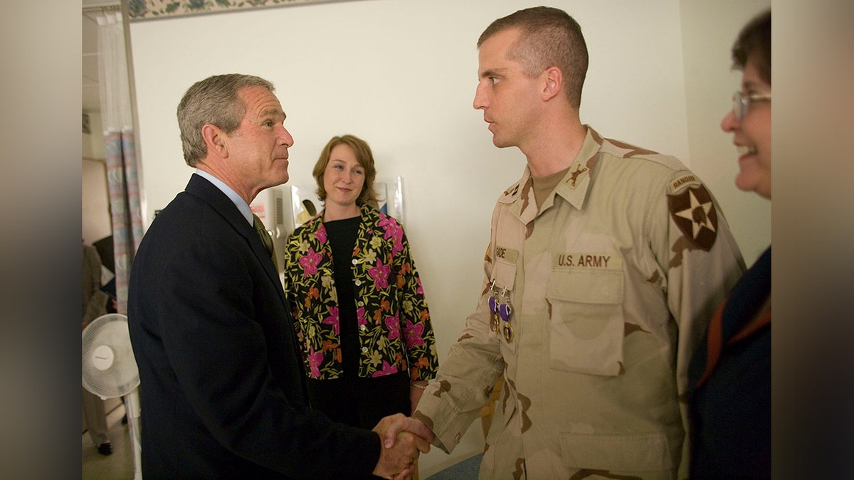 Daniel Gade receives Purple Heart from former President George W. Bush