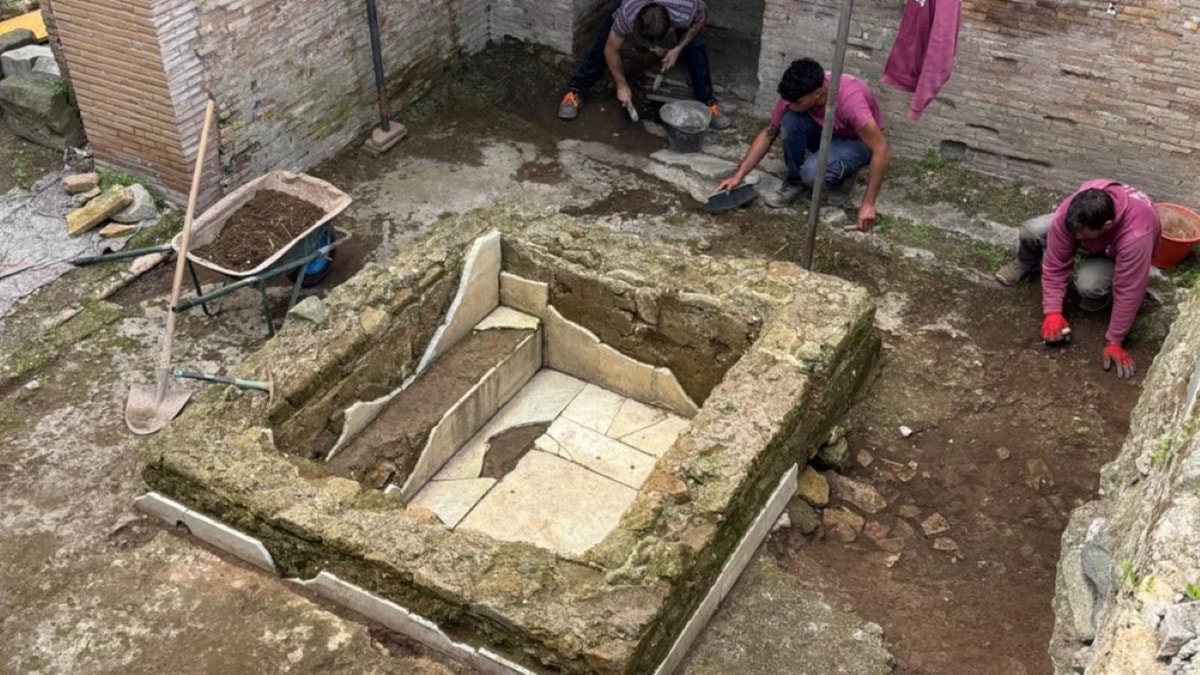 Excavators working around ancient church