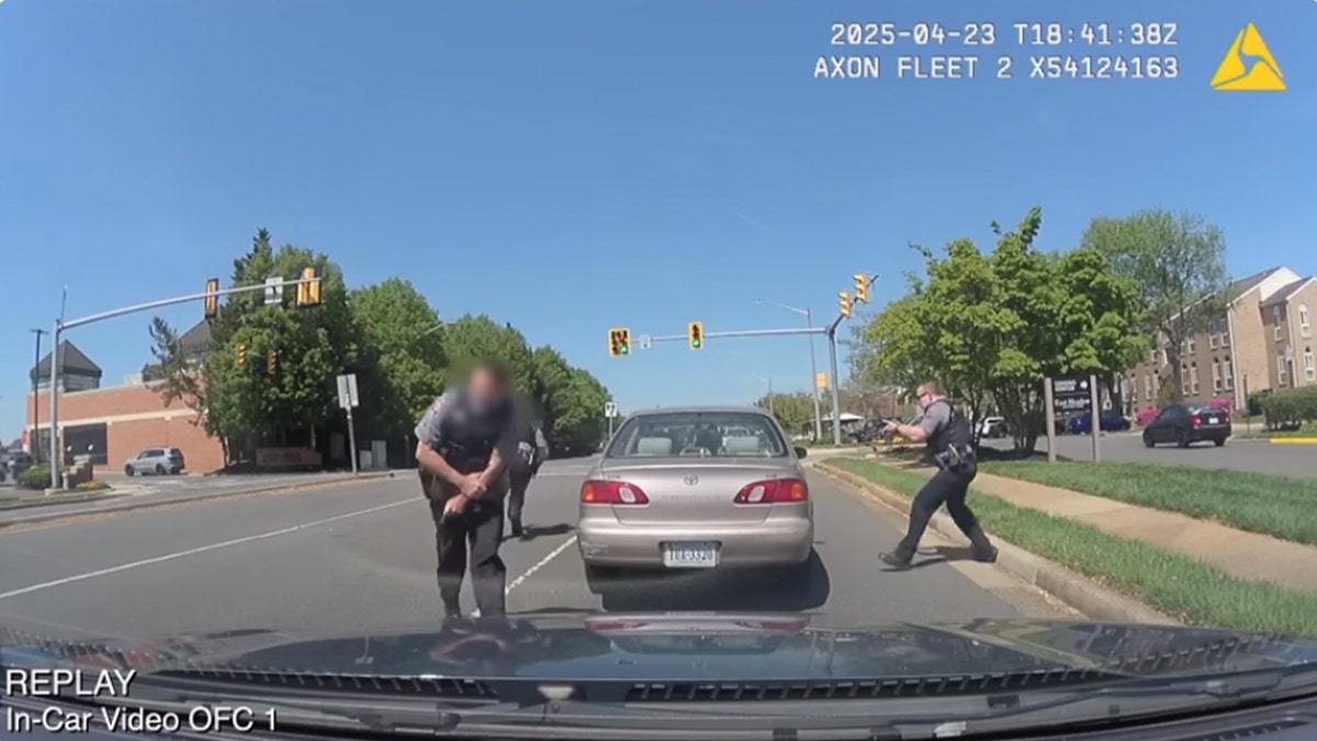 Police react as a driver pulls out a weapon and fires