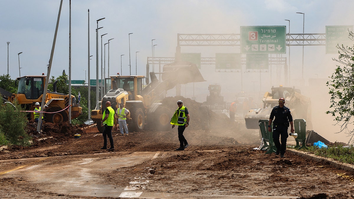 Street construction work near where a missile landed by an Israeli airport