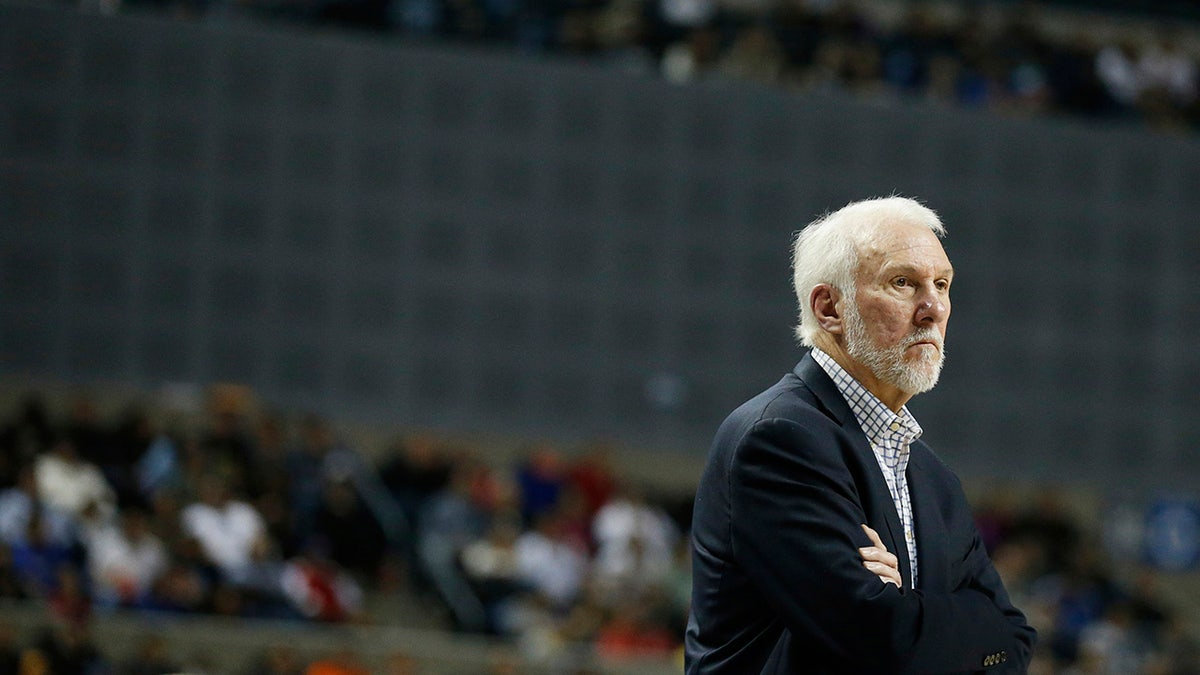 Gregg Popovich looks on