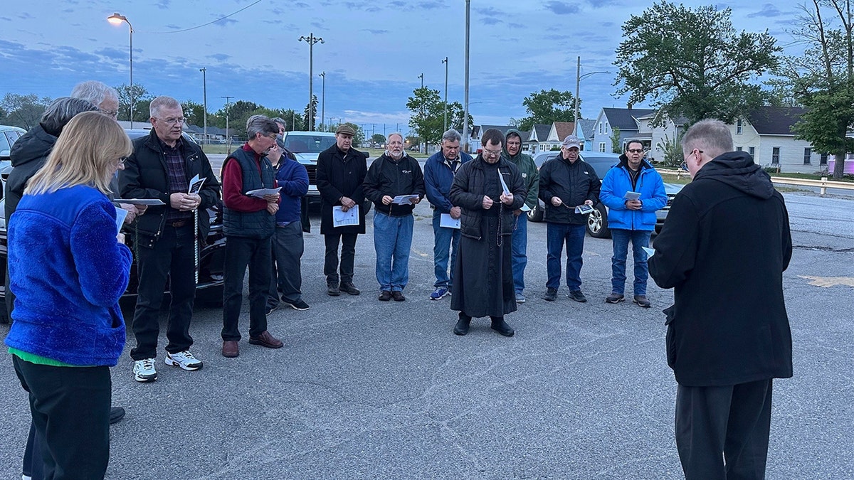People praying in a circle