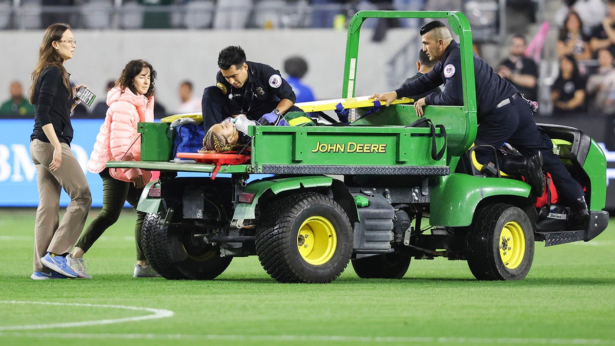 Savy King leaves the game on a cart