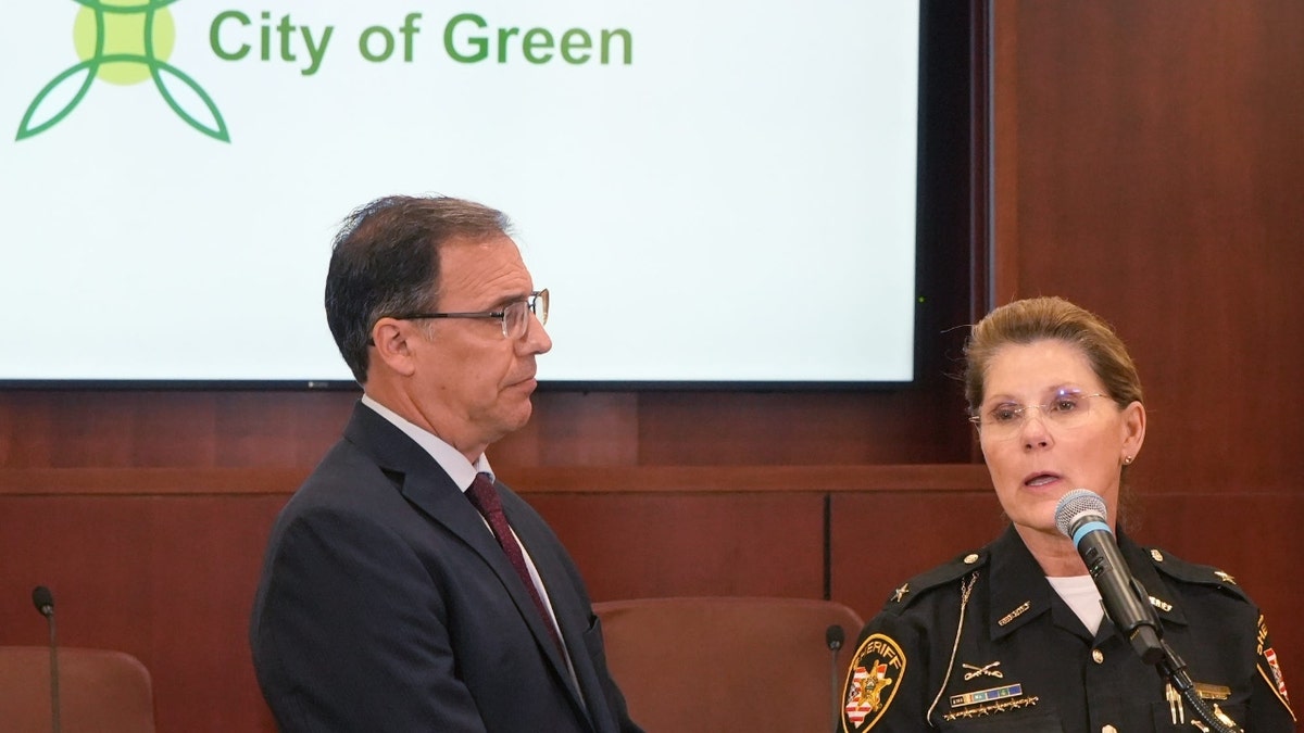 Green Mayor Rocco Yeargin listens as Summit County Sheriff Kandy Fatheree speaks during a press conference on the accidental death of 13 year old Matthew Schultz during the Green Memorial Day Parade during a press conference at Green City Hall on Tuesday, May 27, 2025.
