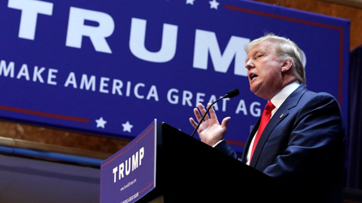 FILE - In this June 16, 2015 file photo, Donald Trump announces he will run for president of the United States, in the lobby of Trump Tower in New York. (AP Photo/Richard Drew, File)