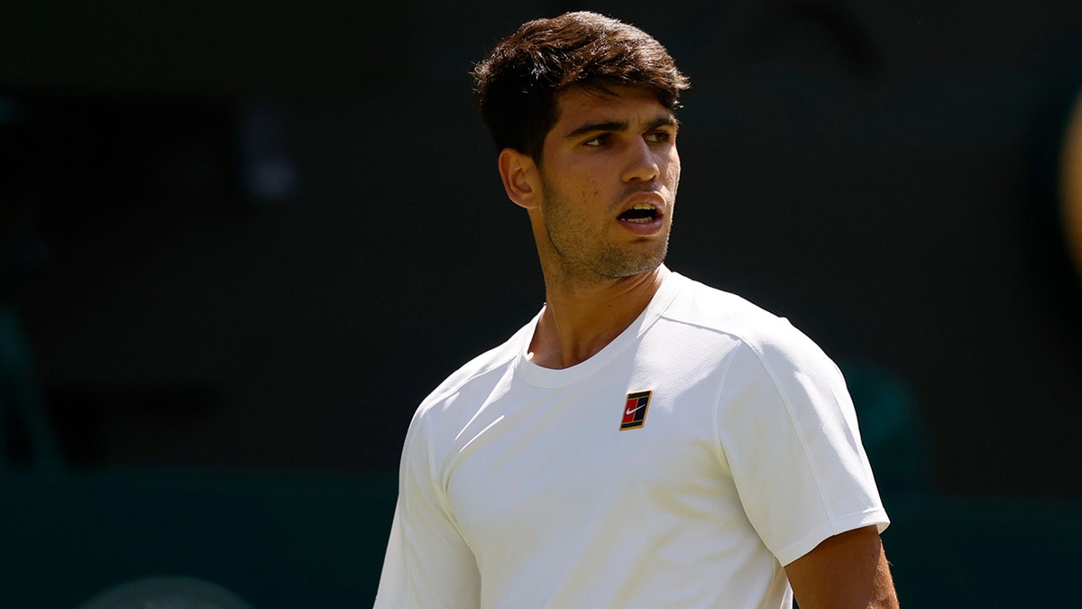 Carlos Alcaraz looks on at Wimbledon