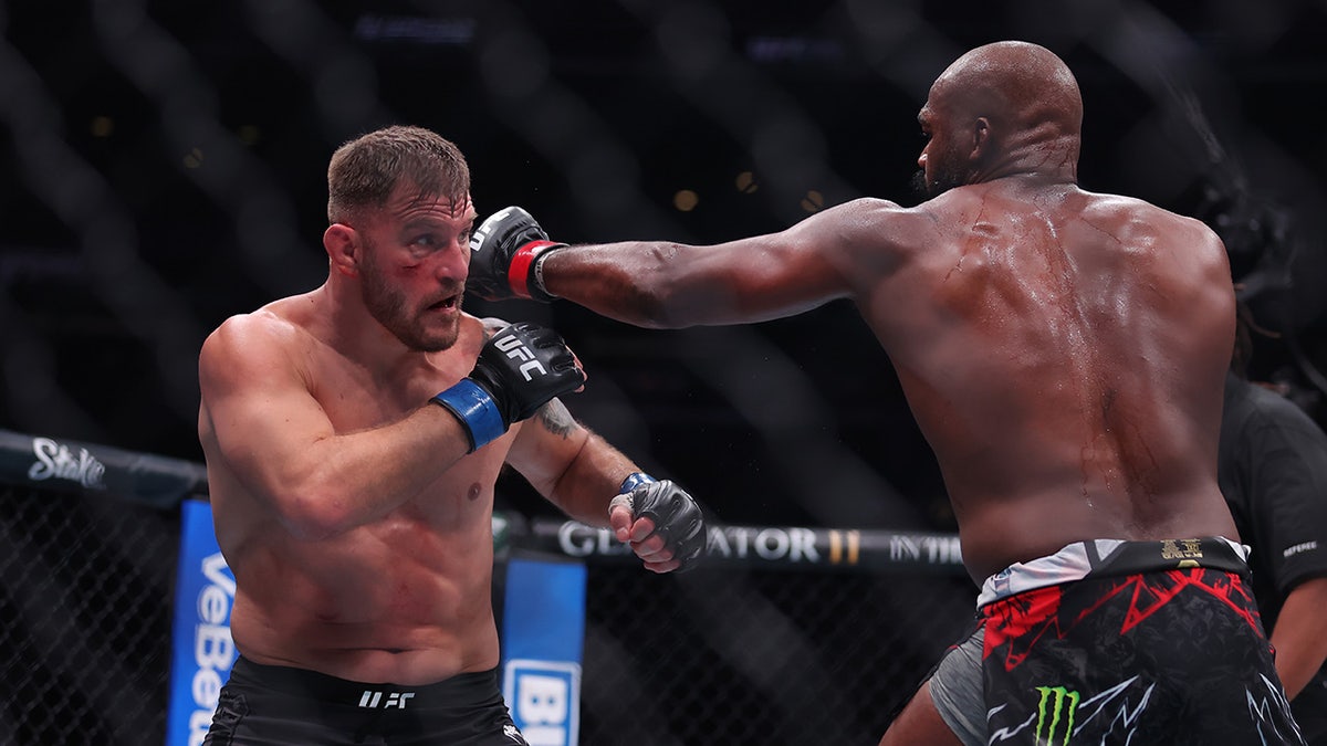 Jon Jones strikes Stipe Miocic