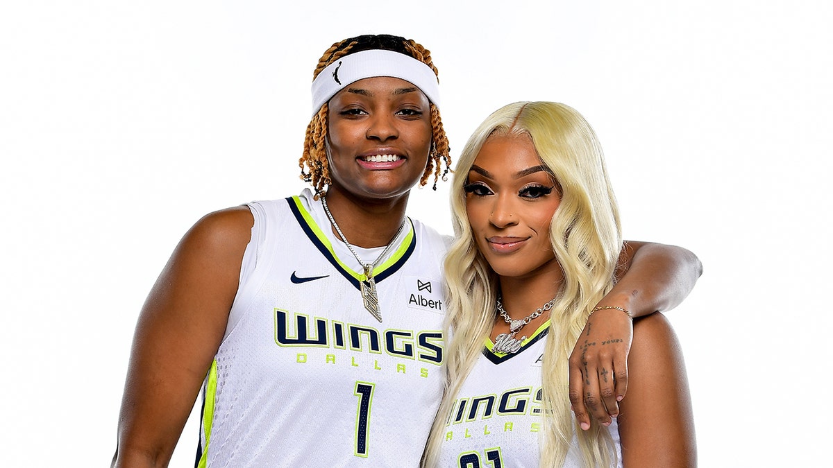 NaLyssa Smith and DiJonai Carrington smile at media day