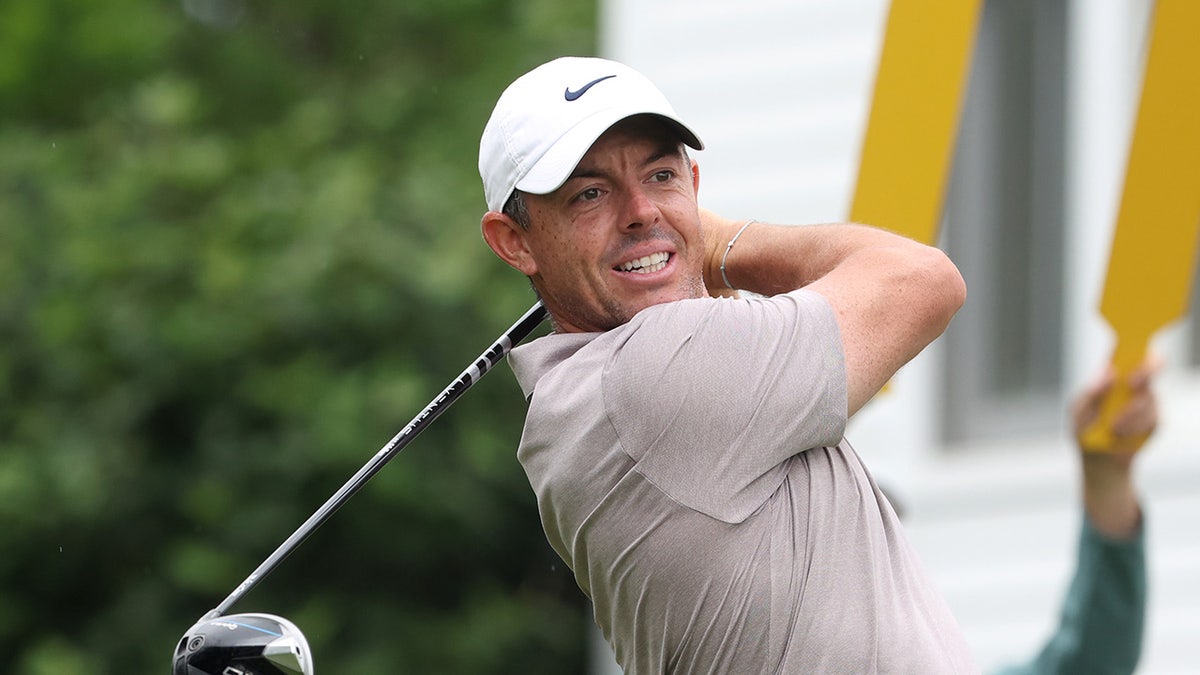 Rory McIlroy plays his shot