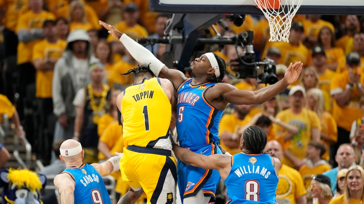 Jun 13, 2025; Indianapolis, Indiana, USA; Indiana Pacers forward Obi Toppin (1) drives to the basket against Oklahoma City Thunder guard Luguentz Dort (5) during the first half during game four of the 2025 NBA Finals at Gainbridge Fieldhouse. 