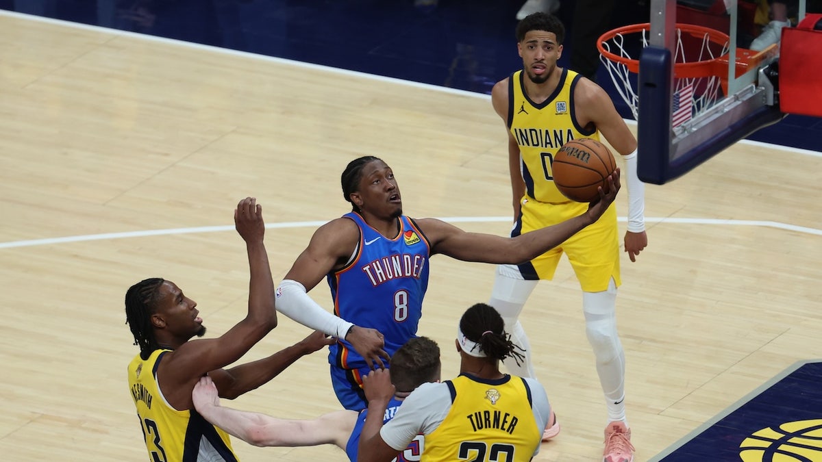 Jun 13, 2025; Indianapolis, Indiana, USA; Oklahoma City Thunder forward Jalen Williams (8) drives to the hoop past Indiana Pacers center Myles Turner (33) during the fourth quarter of game four of the 2025 NBA Finals at Gainbridge Fieldhouse. 
