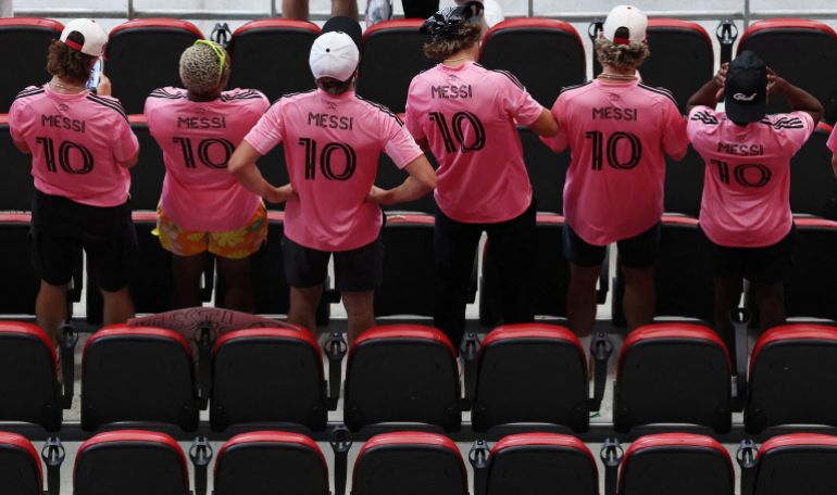 Soccer Football - FIFA Club World Cup - Round of 16 - Paris St Germain v Inter Miami CF - Mercedes-Benz Stadium, Atlanta, Georgia, U.S. - June 29, 2025 Fan wearing Inter Miami CF's Lionel Messi shirts are pictured in the stands before the match REUTERS/Amanda Perobelli TPX IMAGES OF THE DAY