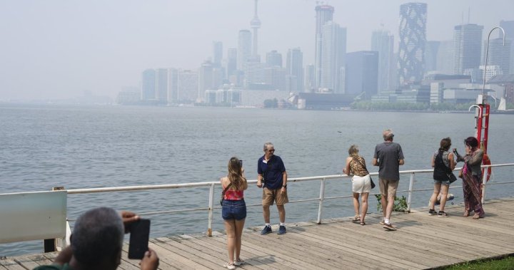 Canadians face air quality, heat warnings as some stuck indoors from both