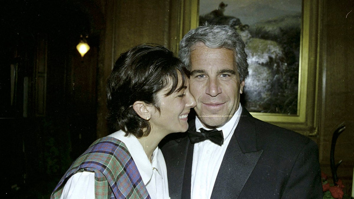 Ghislaine Maxwell and Jeffrey Epstein smile in this undated photograph