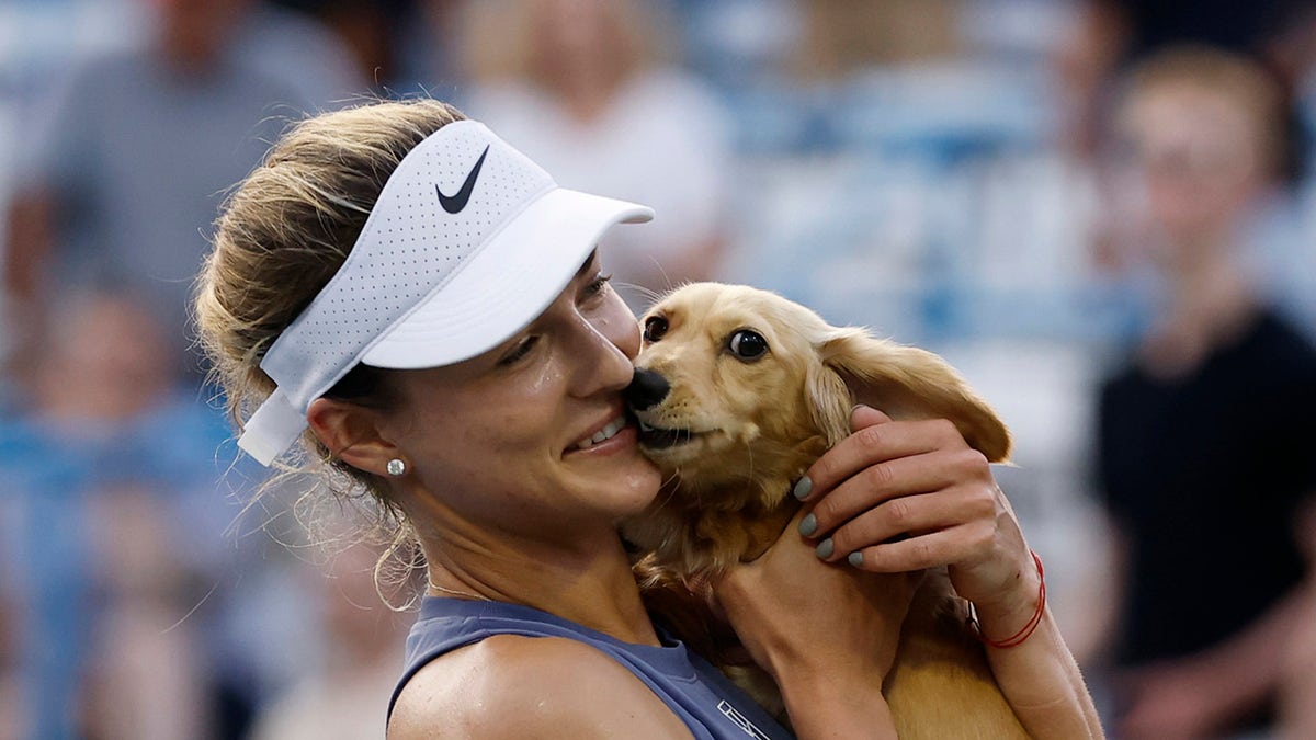 Anna Kalinskaya celebrates with her dog Bella