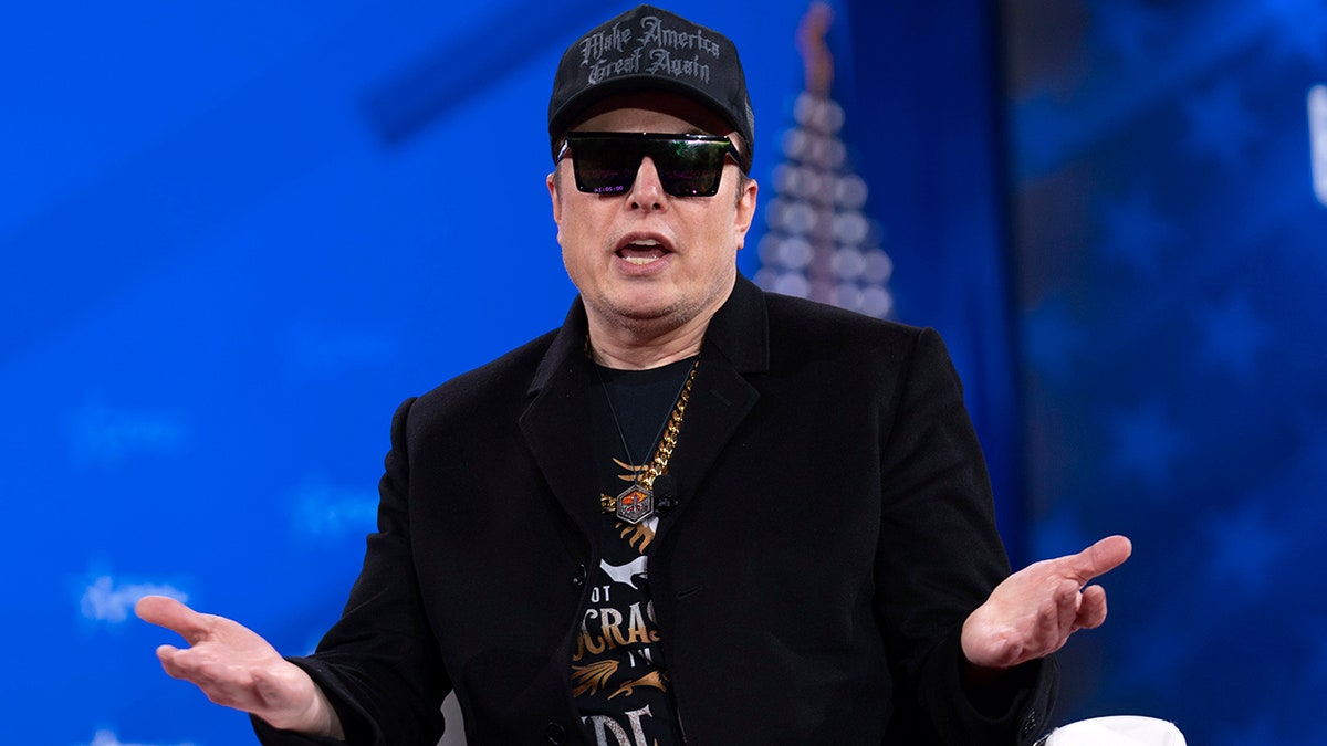 Elon Musk wearing all black