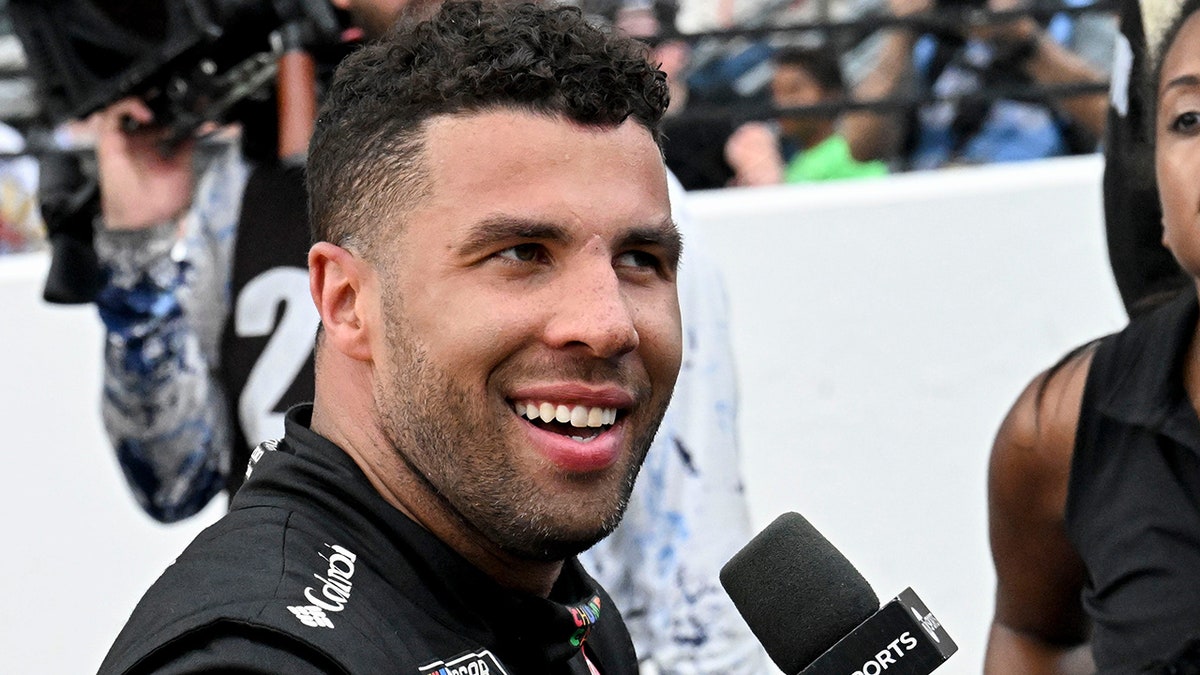 Bubba Wallace smiles after winning Brickyard 400