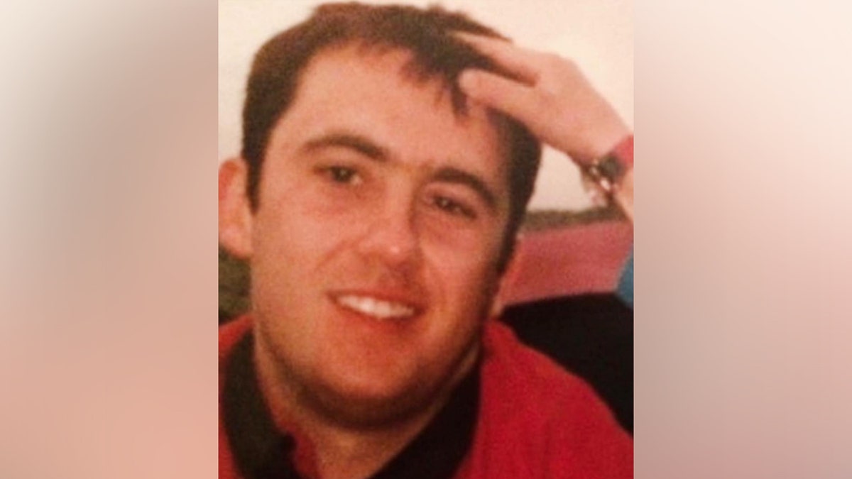 Jason Corbett smiling while someone touches his hair