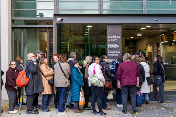 Members of the public line up early to get a seat in court.