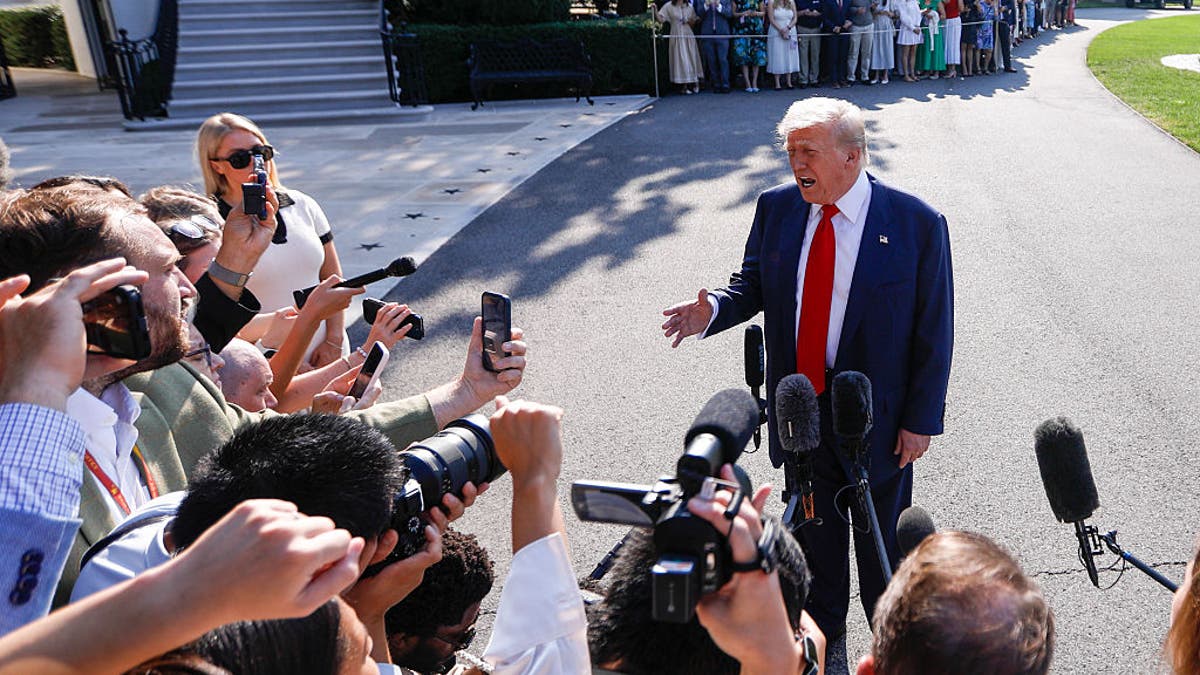President Donald Trump speaks to members of the media before departing the White House en route to Turnberry, Scotland, July 25, 2025, in Washington, DC, United States. (Yasin Ozturk/Anadolu via Getty Images)