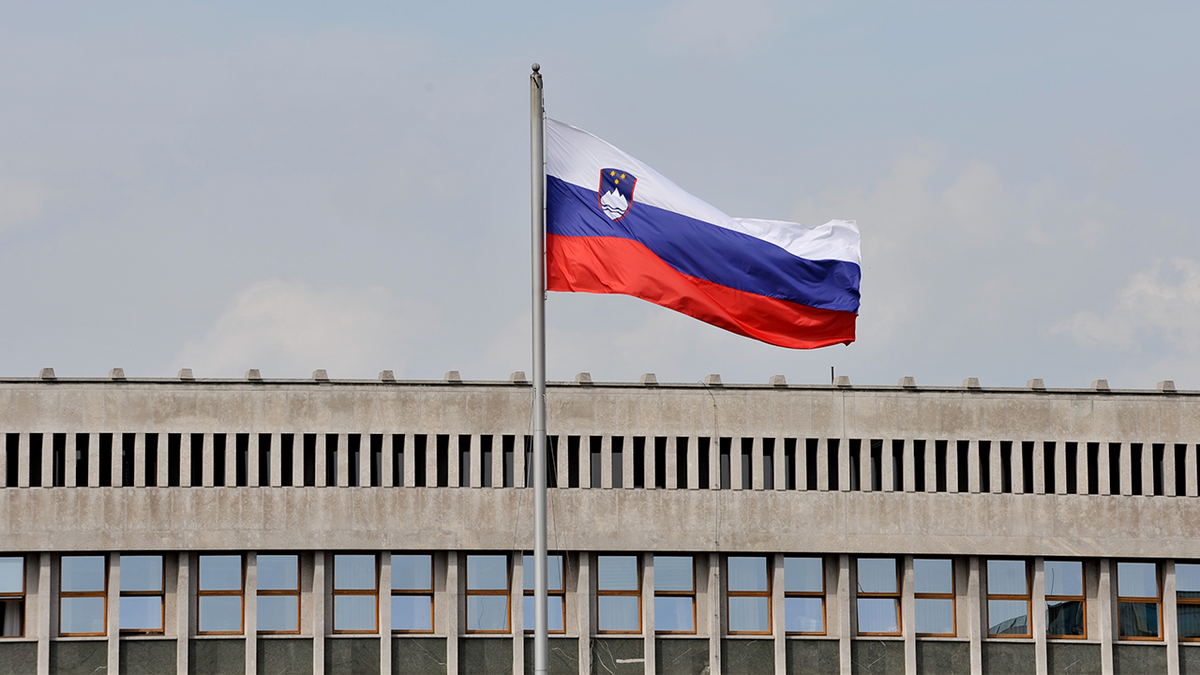 Slovenian flag in front of parliament.