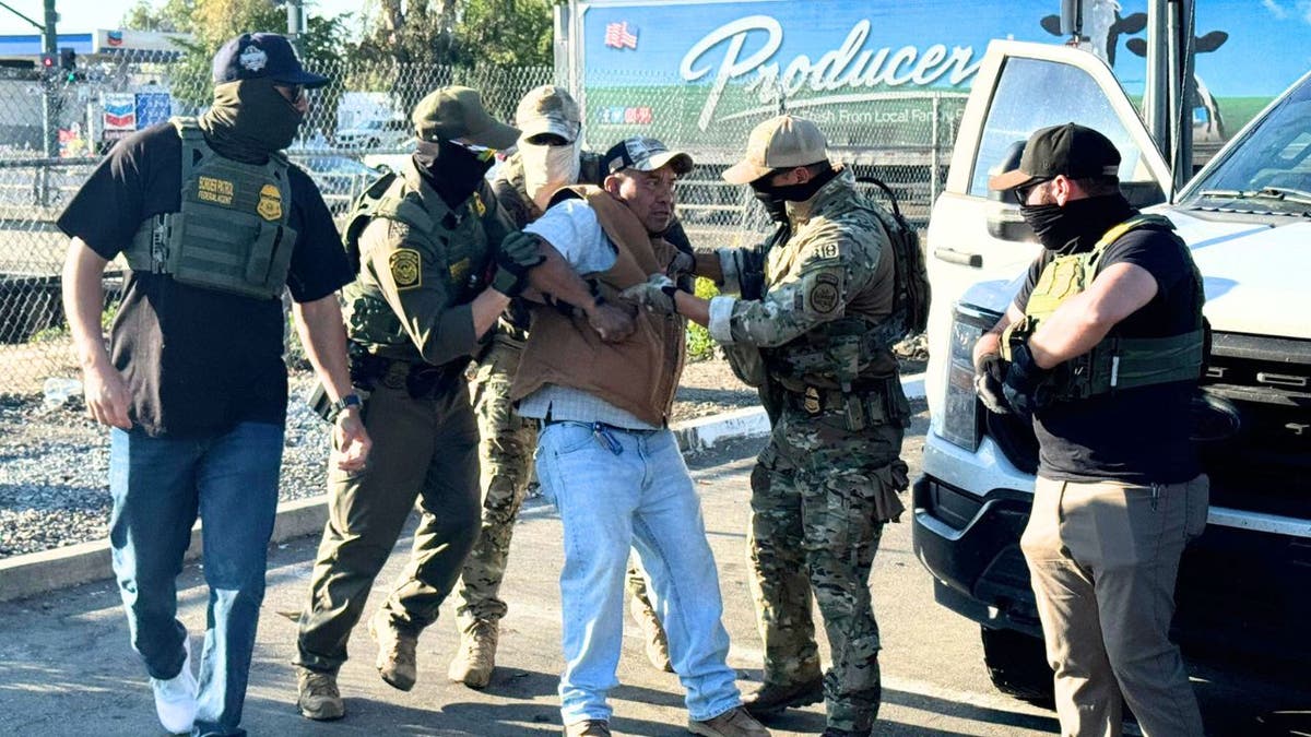 Border Patrol agents arresting a man