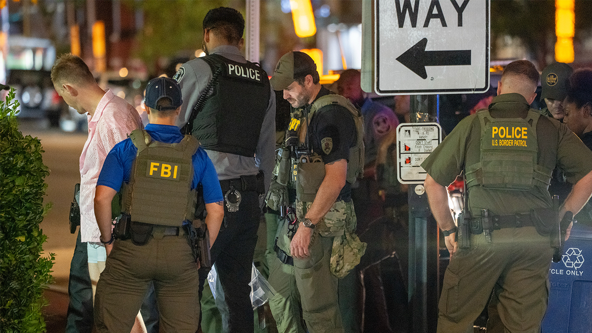 FBI and Border Patrol officers arrest a man after he allegedly assaulted law enforcement with a sandwich, along the U Street corridor during a federal law enforcement deployment to the nation's capital on August 10, 2025 in Washington, DC. U.S. President Donald Trump ordered an increased presence of federal law enforcement to Washington, DC in an effort to curb crime.
