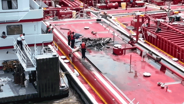 Two people killed after helicopter hits power line and crashes into barge on Mississippi River