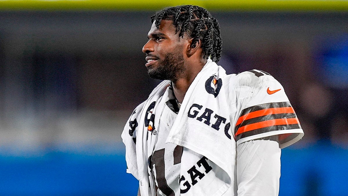 Shedeur Sanders looks on field after game