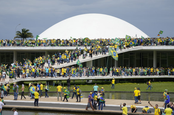 Bolsonaro’s supporters storm Brazil’s  Congress in Brasilia on January 8, 2023, a week after his successor Luis Inacio Lula da Silva, took office.
