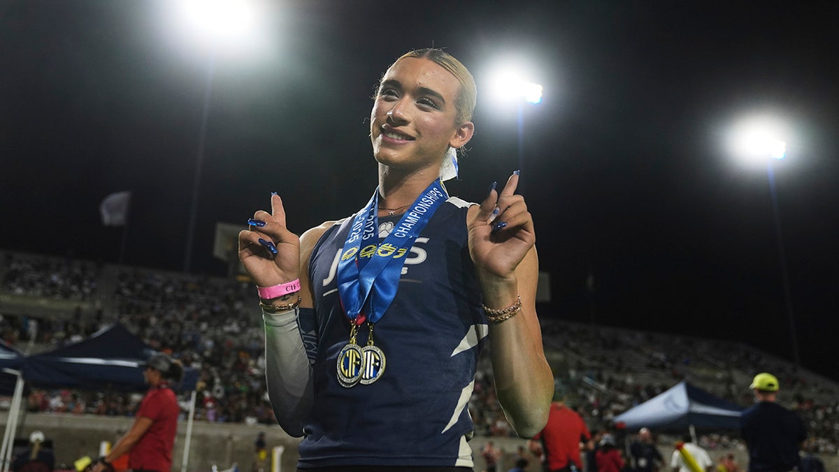 AB Hernandez poses after winning medals