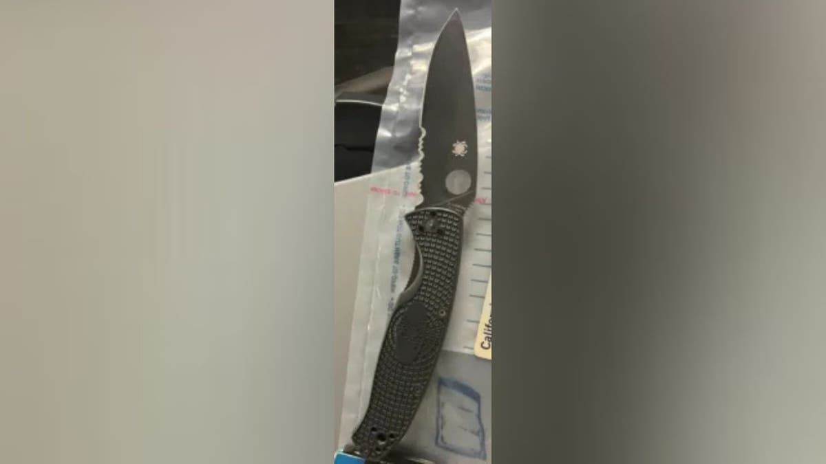 Evidence photo shows folding knife recovered after assault on ICE agents in San Francisco