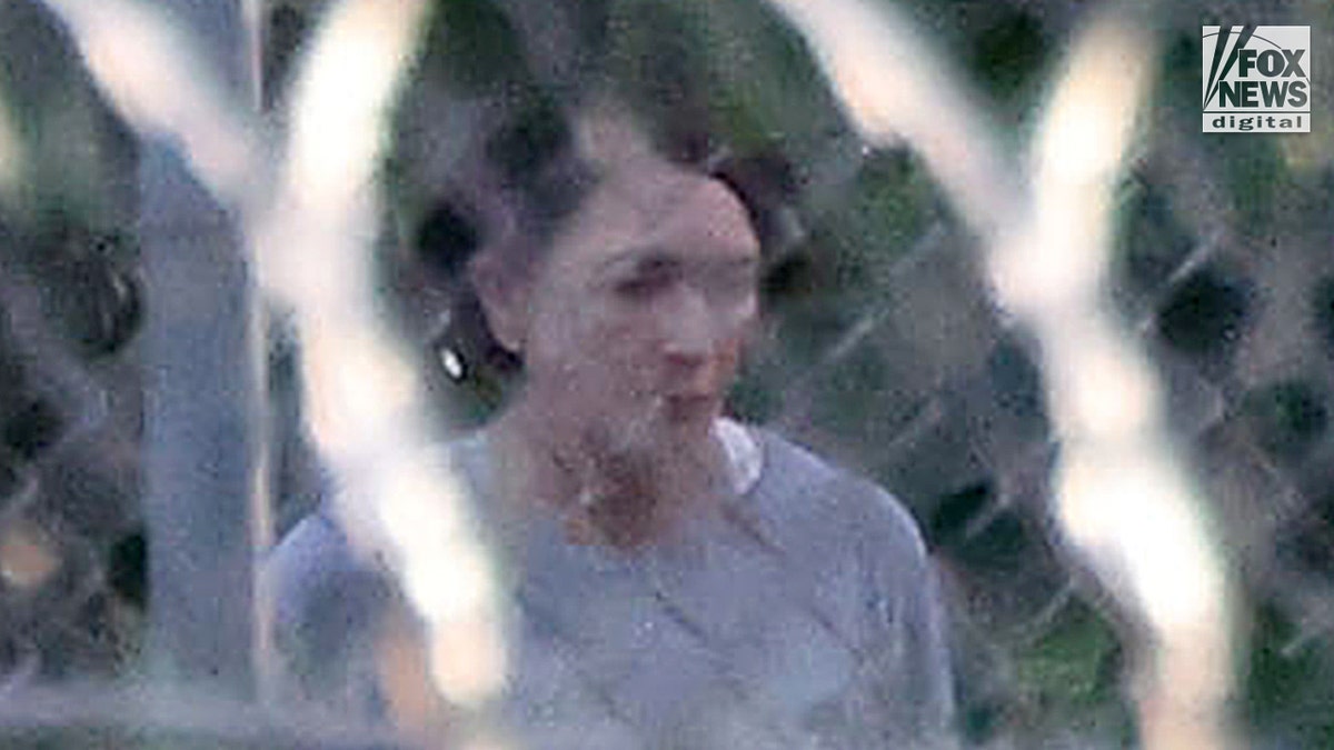 Ghislaine Maxwell is seen behind razor wire in prison