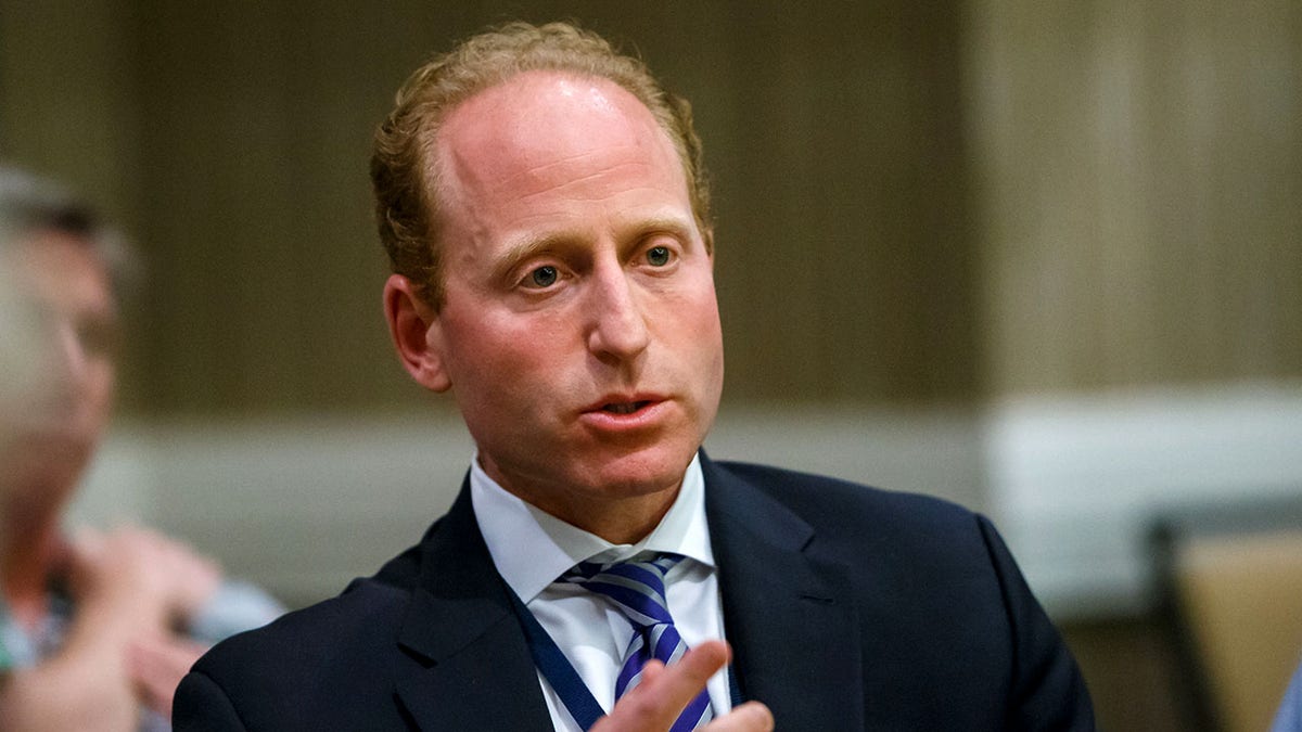 Jeff Miller speaks at a press conference