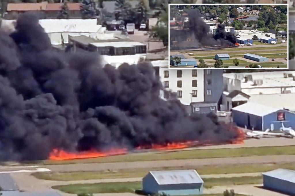 Small plane crashes and hits several parked aircraft, sparking massive fireball