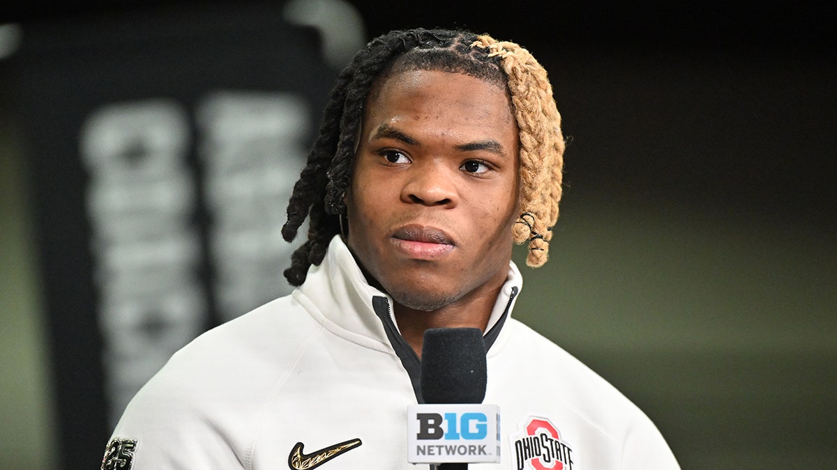 Quinshon Judkins speaks to the media