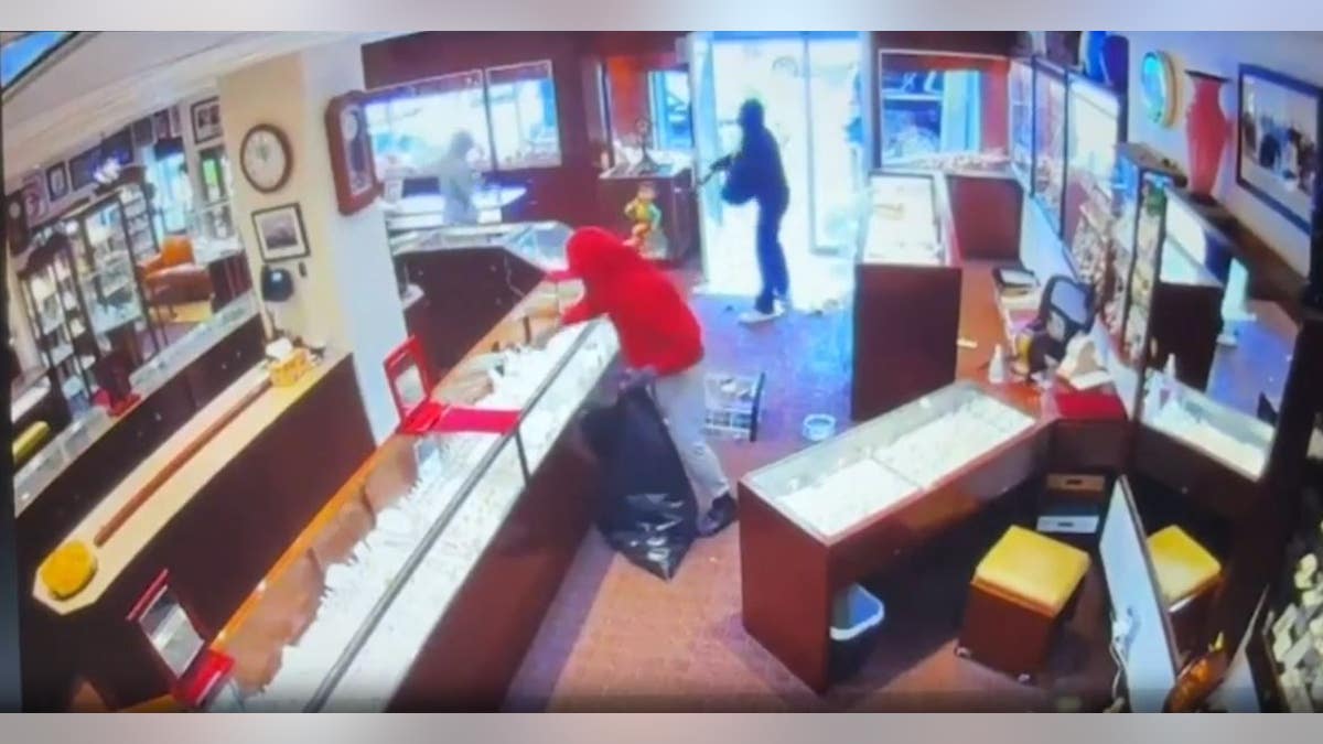 Thieves smashing display cases