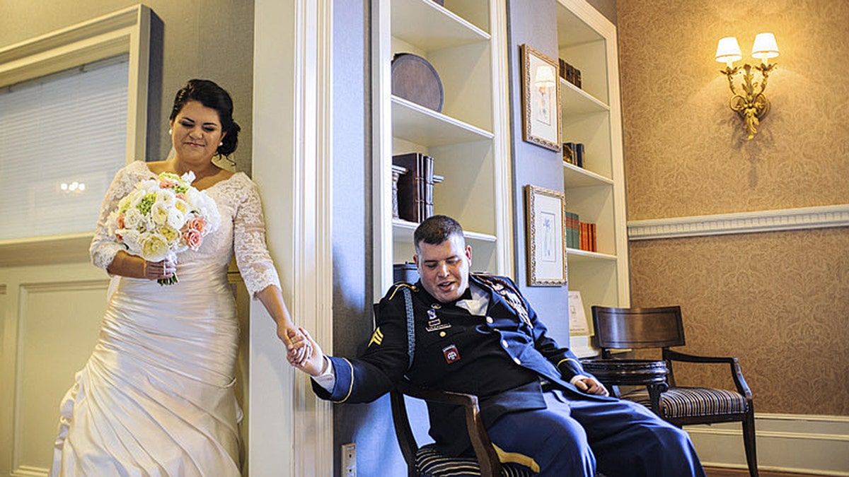 Sgt. Michael Verardo held hands with bride Sarah on their wedding day after his recovery from Afghanistan injuries.