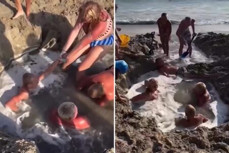 Horrifying video shows frantic beachgoers scramble to save boys trapped in sand hole after it’s filled with water
