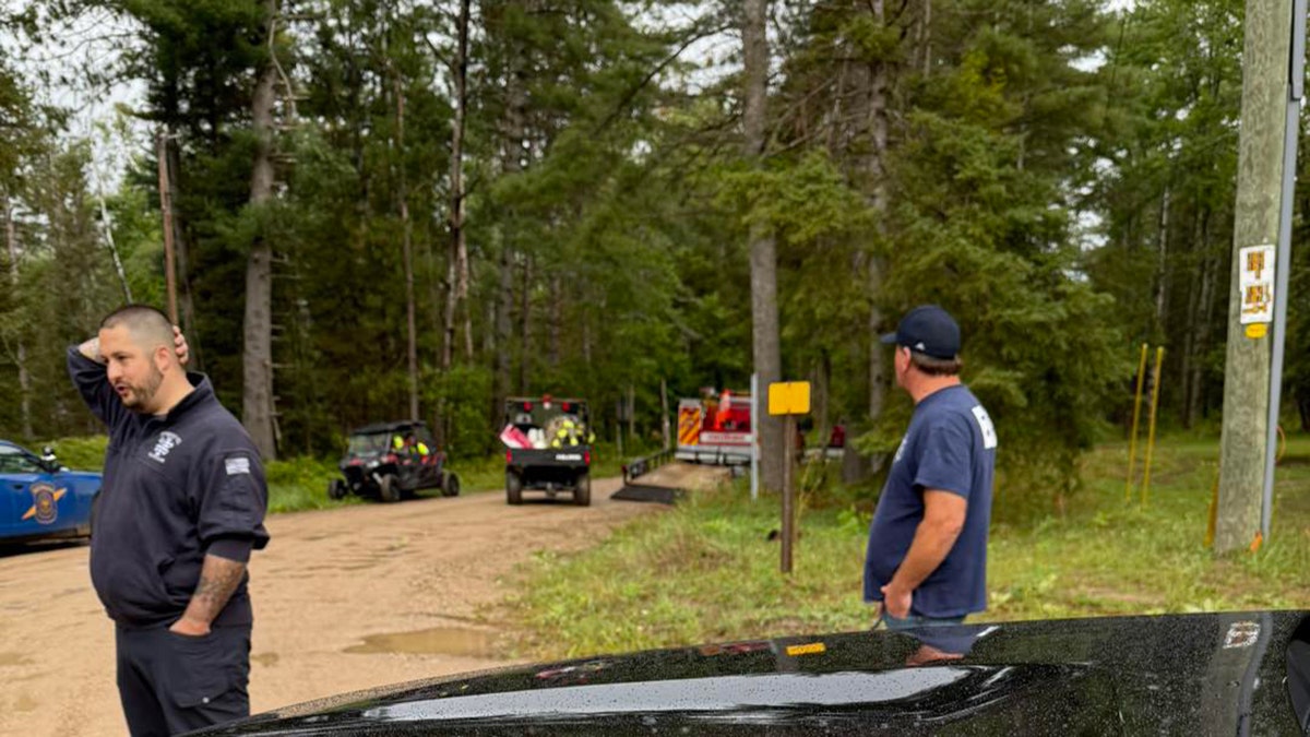 Otsego County Emergency Management personnel in wooded area