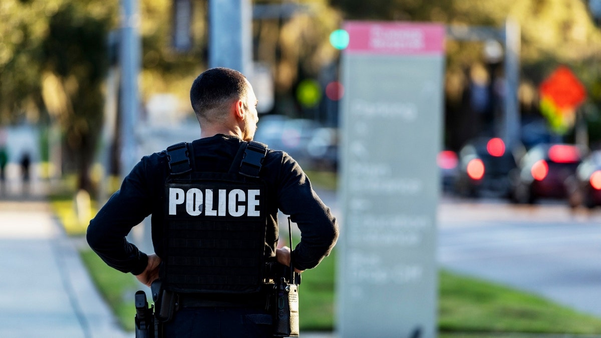 Police officer stands guard