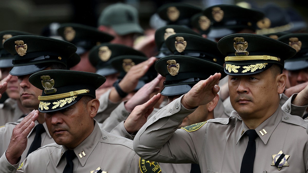 Members of the Los Angeles Sheriff's Department salute during the National Peace Officers Memorial Service at the U.S. Capitol on May 15, 2024, in Washington, DC. The Service honors law enforcement officers who have been killed in the line of service.Â